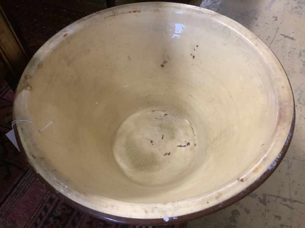 A Victorian glazed earthenware cream bowl, 52cm diameter